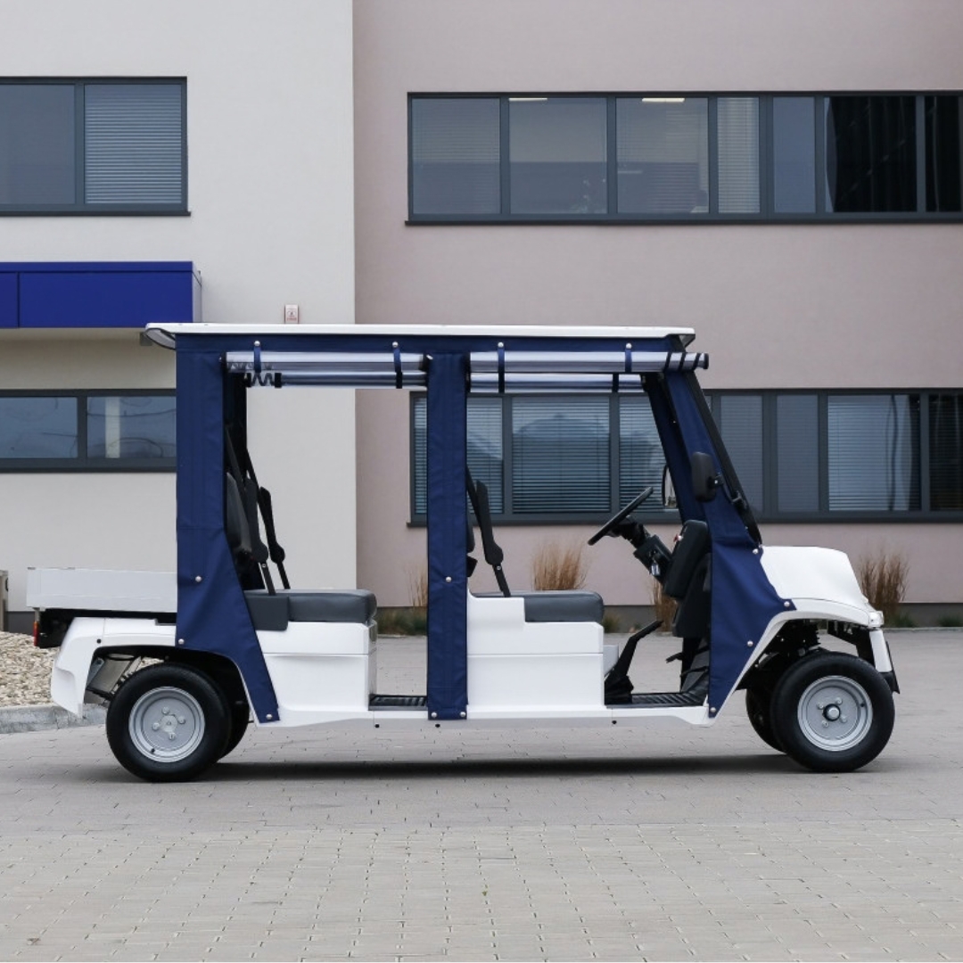 Melex N.20 Passenger 4 H con tettuccio blu all'esterno, vista laterale